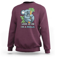 Maroon crewneck sweatshirt with koala graphic and 'LOOK AT ME I'M A KOALA' text