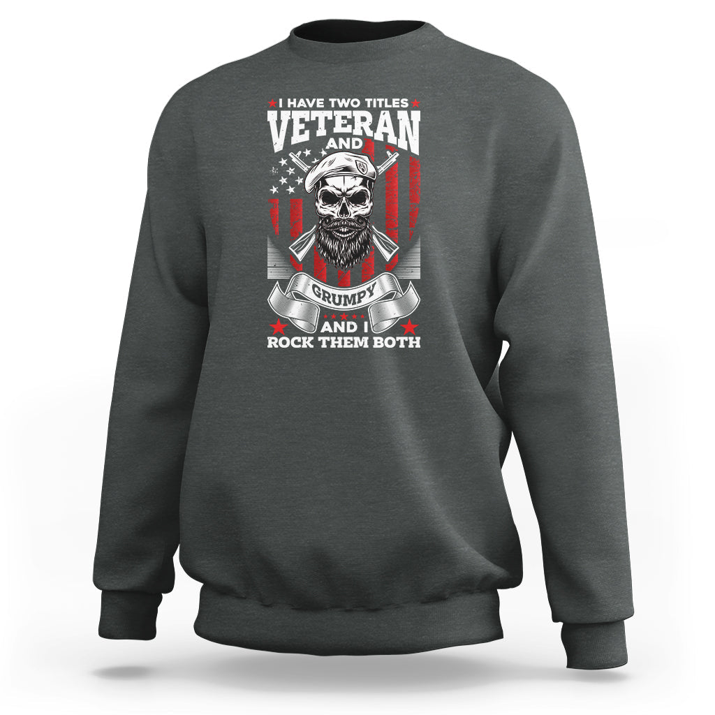 Dark heather crewneck sweatshirt with Veteran graphic, grumpy skull and flags on chest.