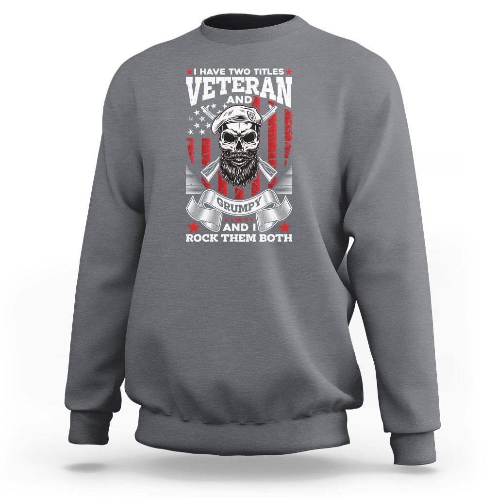 Charcoal gray crewneck sweatshirt with Veteran graphic, grumpy skull and flags on chest.