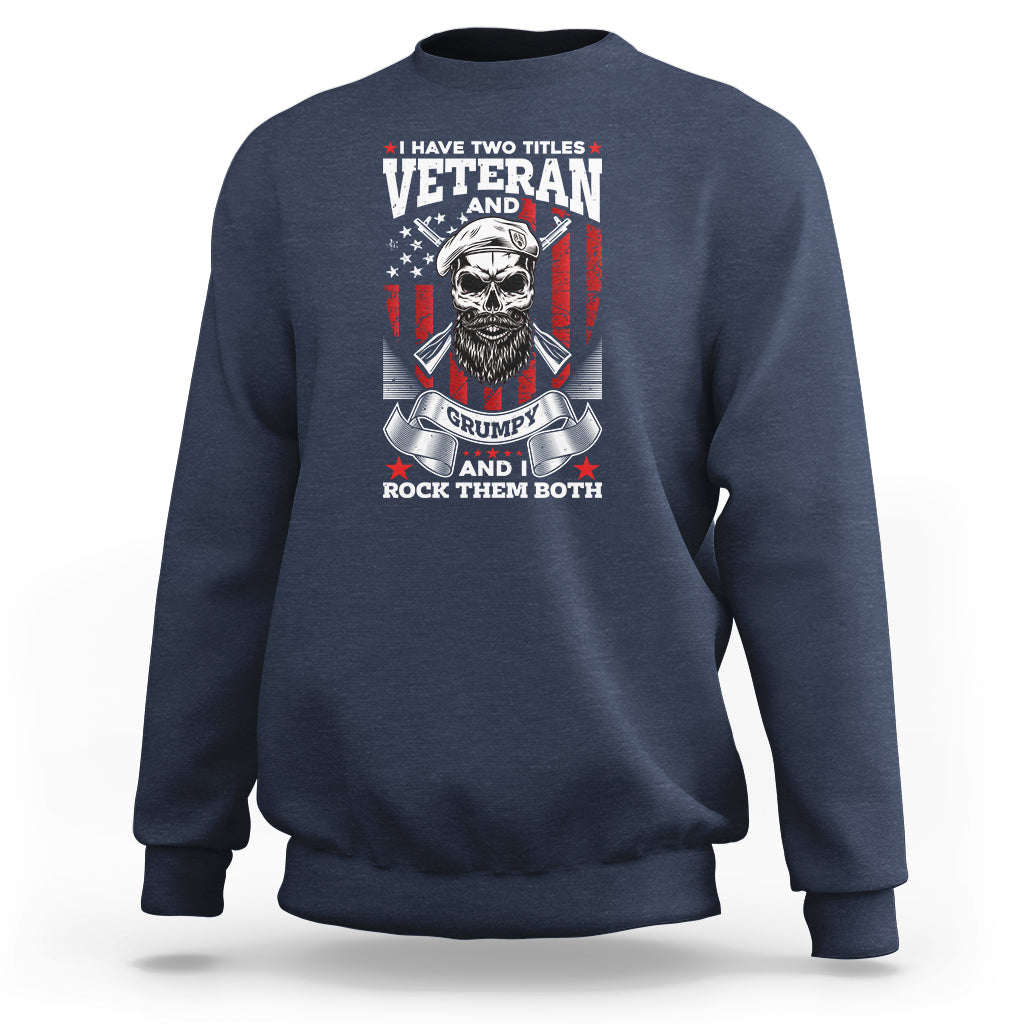 Navy crewneck sweatshirt with Veteran graphic, grumpy skull and flags on chest.
