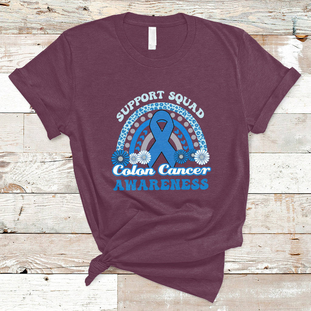 Maroon t-shirt with Support Squad Colon Cancer Awareness text and blue awareness ribbon graphic.