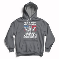 Dark gray veteran pride hoodie with chest graphic, front pocket, and drawstring hood