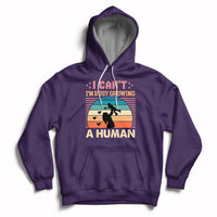 Purple maternity pullover hoodie with kangaroo pocket and drawstring hood; busy human graphic