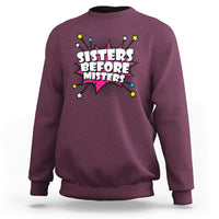 Maroon retro crewneck sweatshirt with long sleeves and “Sisters Before Misters” graphic.