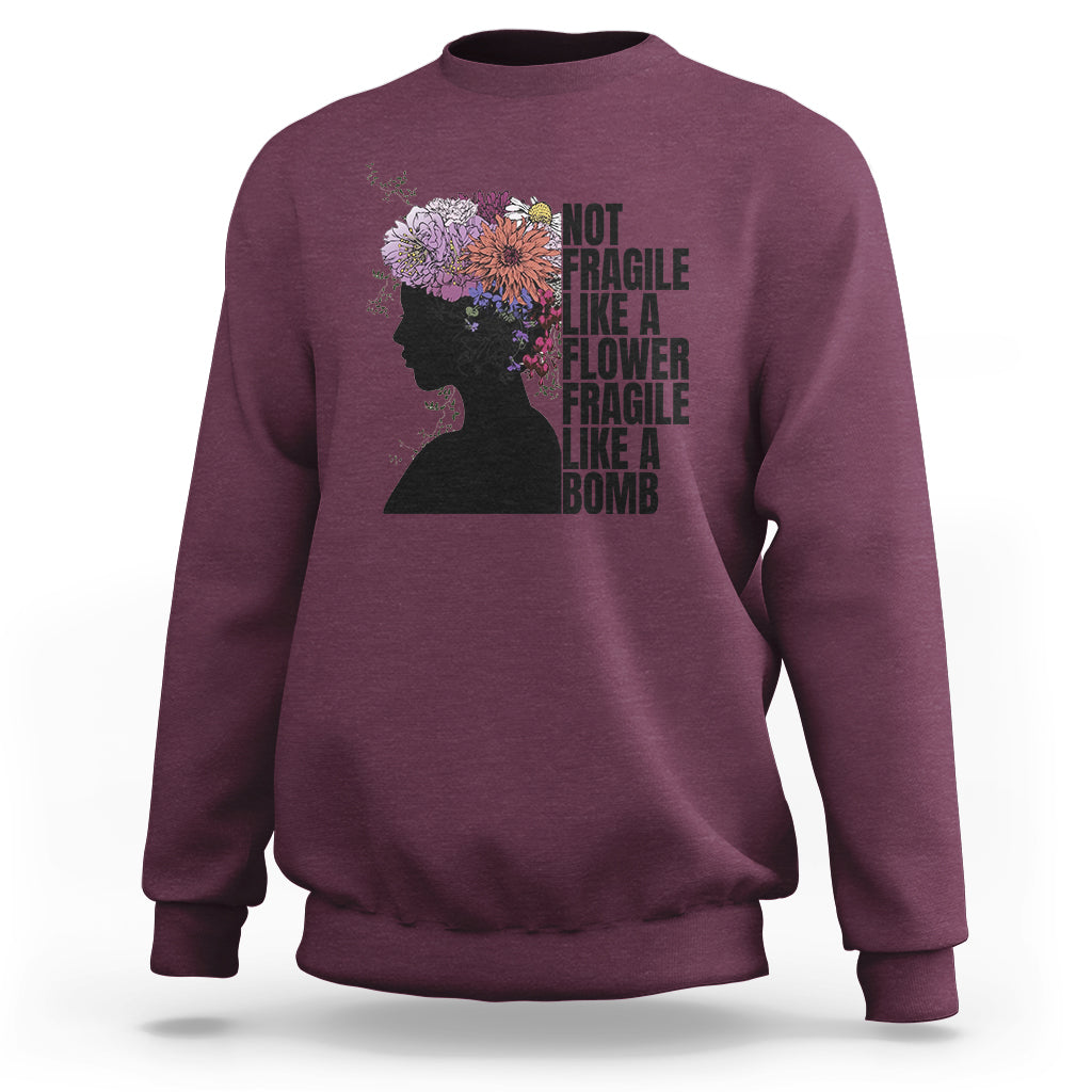 Women’s sweatshirt (back) maroon with floral silhouette and stacked “Not fragile” text