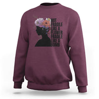 Women’s sweatshirt (back) maroon with floral silhouette and stacked “Not fragile” text