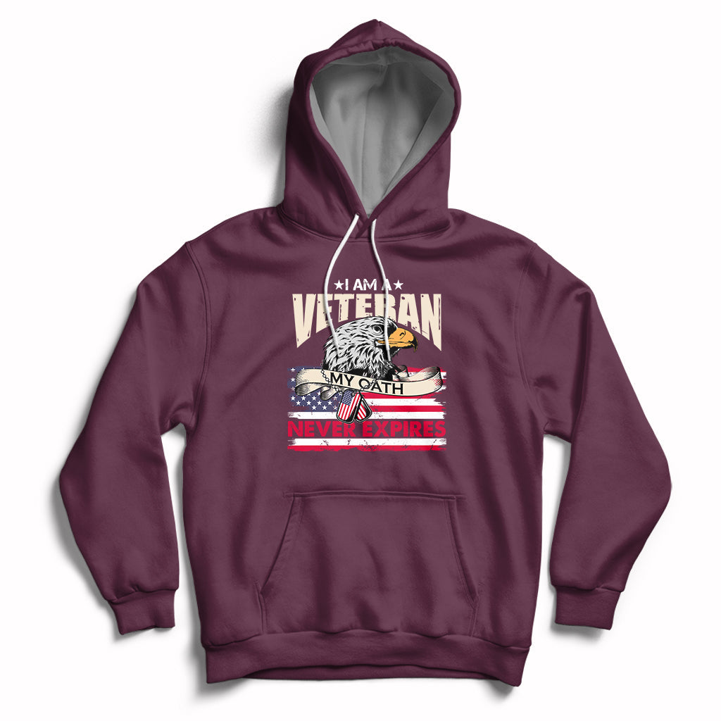 Maroon pullover hoodie with front pocket and patriotic veteran graphic, hood with white drawstrings.