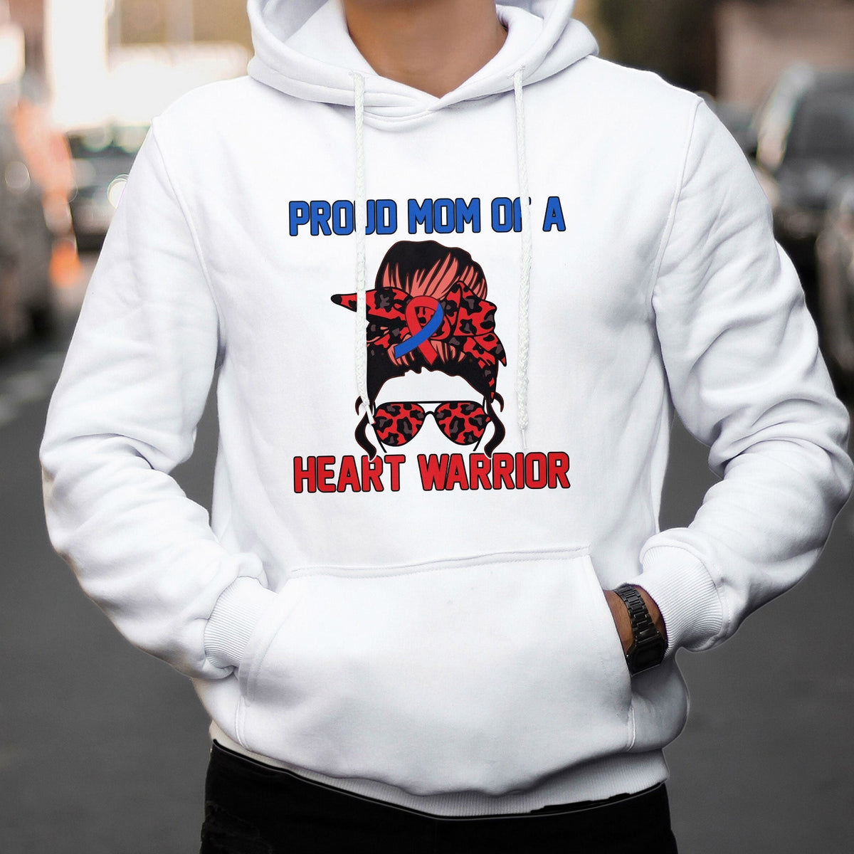 White hoodie with “Heart Warrior” heart-defect awareness graphic on the chest