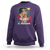 Adult crewneck sweatshirt, purple, front graphic with face and “Education is Freedom”.