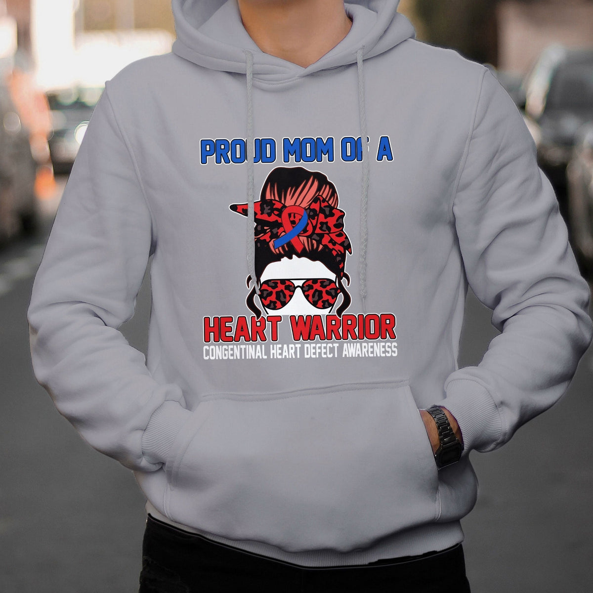 Light gray hoodie with “Heart Warrior” heart-defect awareness graphic on the chest