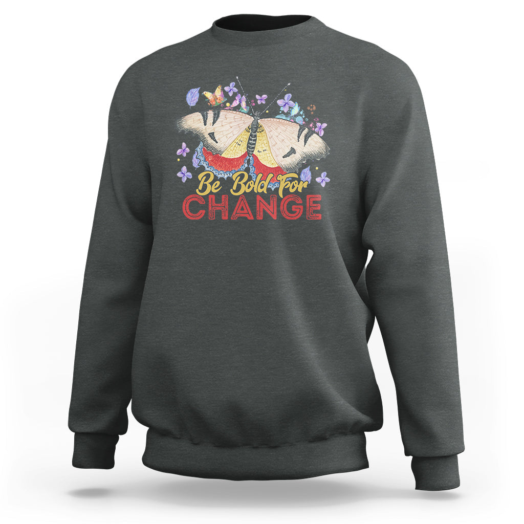 Women's dark heather sweatshirt with colorful butterfly and “Be Bold for Change” graphic