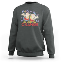 Women's dark heather sweatshirt with colorful butterfly and “Be Bold for Change” graphic