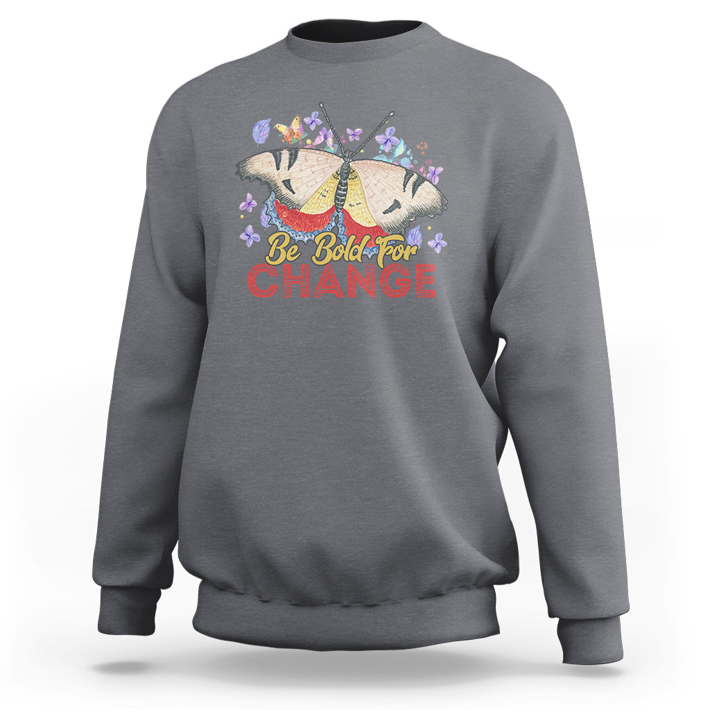 Women's charcoal sweatshirt with colorful butterfly and “Be Bold for Change” graphic