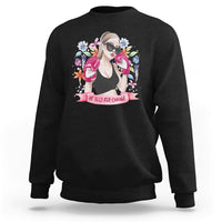 Women’s black graphic sweatshirt with illustrated girl and floral “Be Bold for Change”