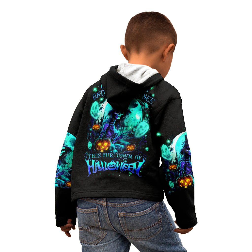 Black hoodie worn by child, turquoise skull Halloween back graphic, hood and sleeves