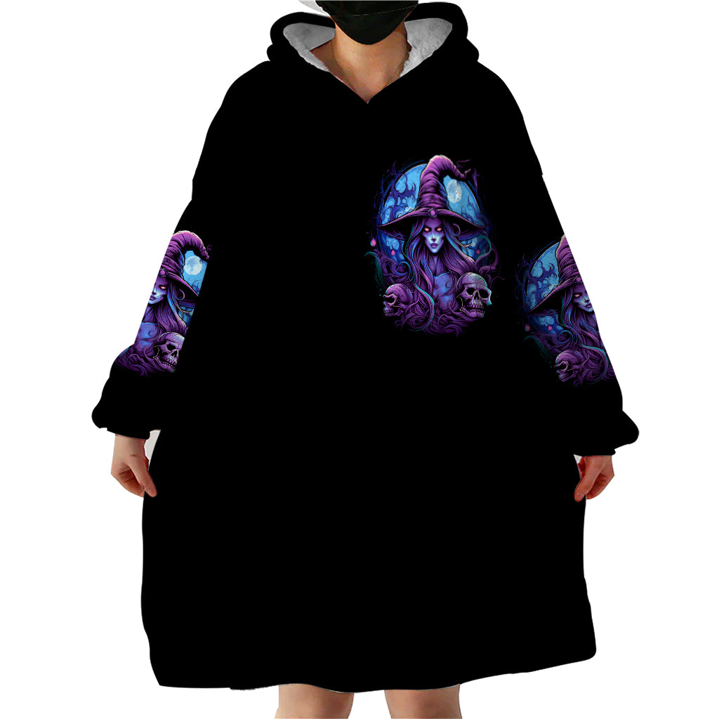 Black hooded wearable blanket hoodie with front witch skull design, oversized blanket-like length