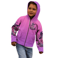 Pink kids zip hoodie on model, hood up with front witch skull graphic