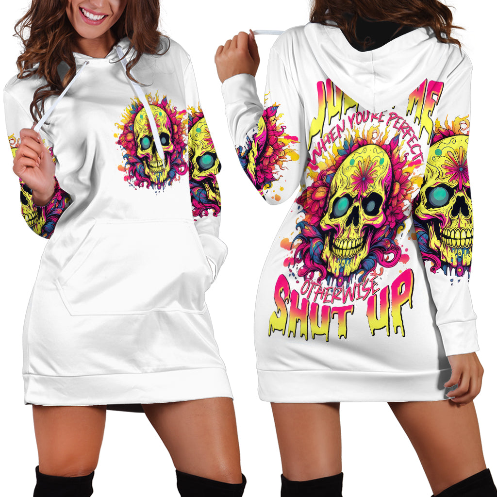 White hoodie dress shown front and back, colorful skull prints, hood, long sleeves, pocket.