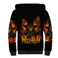 Black sherpa hoodie with witch skull graphic, flames on sleeves, front pocket