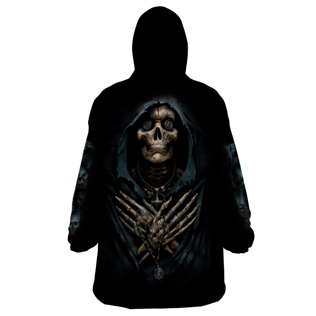 Black wearable blanket hoodie with hood, skull graphic on back, and long sleeves.