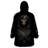 Black wearable blanket hoodie with hood, skull graphic on back, and long sleeves.