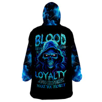 Wearable blanket hoodie with skull graphic, blue flame-style on black base, front view