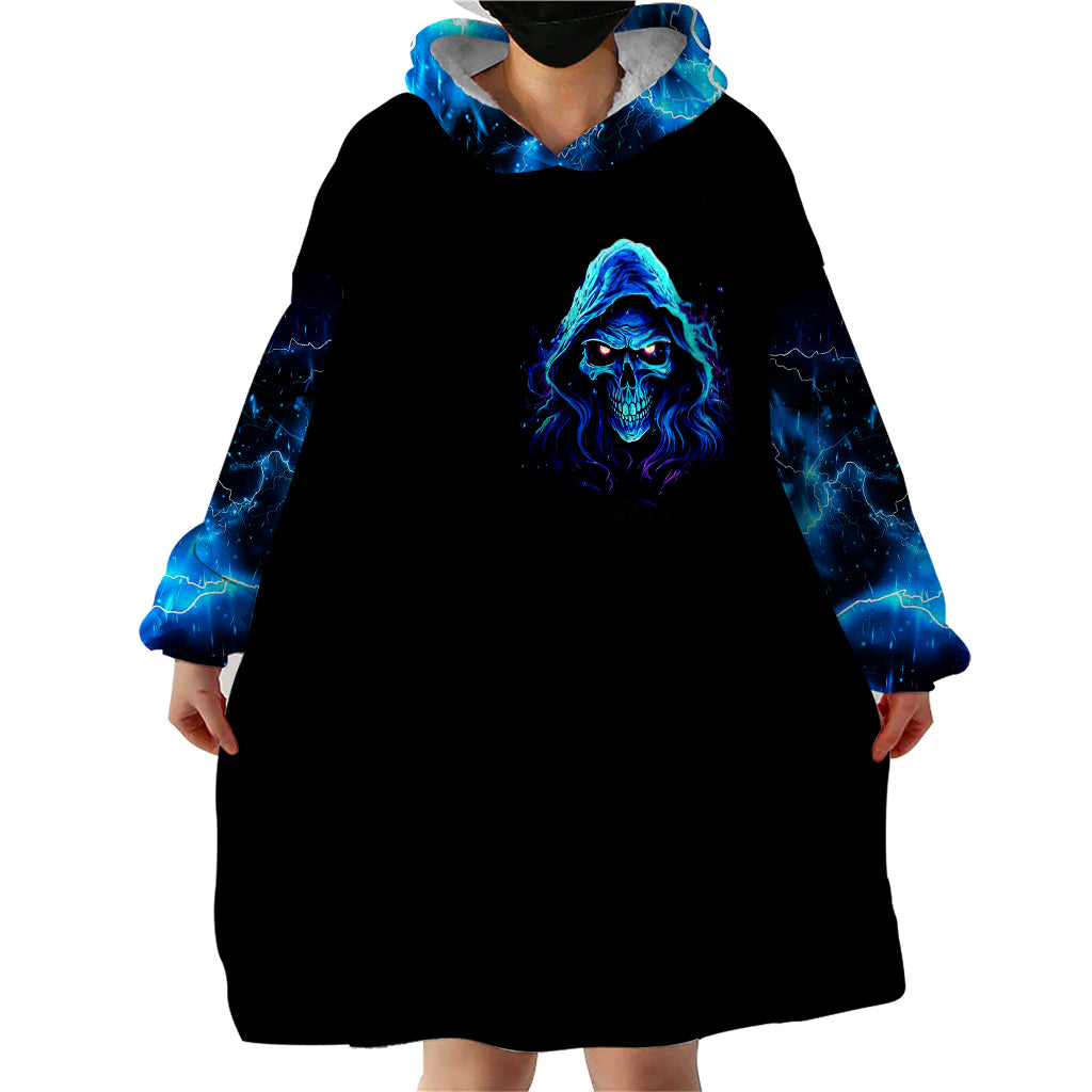 Wearable blanket hoodie dress with blue skull face print, hooded black fleece, side view