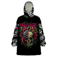 Black wearable blanket hoodie with colorful skull, roses, and long sleeves, front pocket.