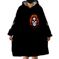 Black wearable blanket hoodie, hooded skull emblem on front, oversized blanket-style fit