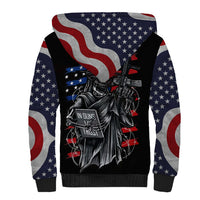 Unisex sherpa hoodie with American flag sleeves and black front with skull pistol graphic