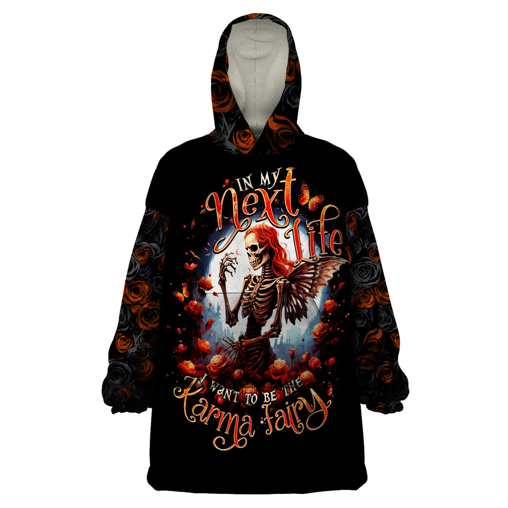 Black wearable blanket hoodie with hood and colorful fairy-skeleton front graphic
