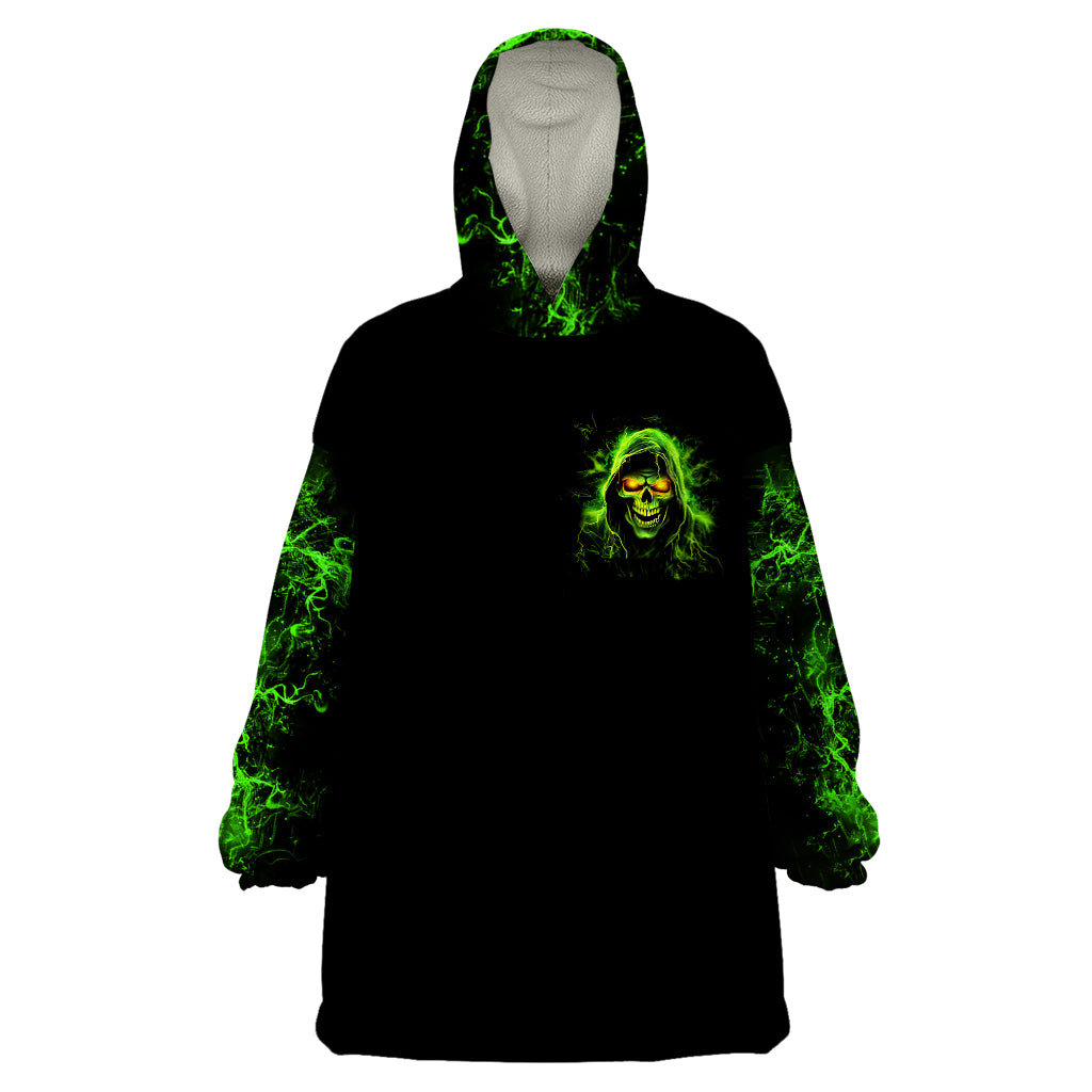 Black blanket hoodie with green skull emblem, hood and long sleeves, front pocket