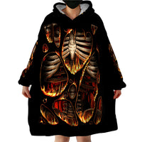 Black skeleton blanket hoodie with hood and large front flame ribcage print, hands visible