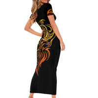 Black bodycon midi dress with short sleeves and golden tattoo skull graphic, side view