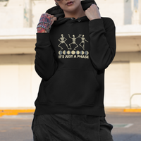 Black hoodie with moon-phase skeleton dancers graphic and 'It's Just A Phase' text