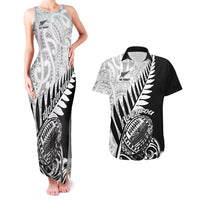 Black sleeveless tank maxi dress and black Hawaiian shirt with white fern and Maori-style print