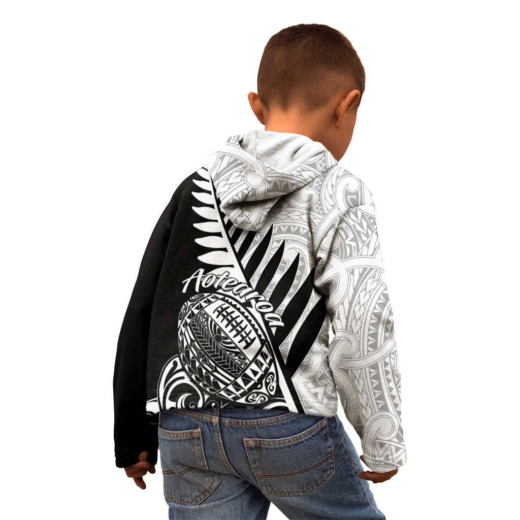 Kids’ rugby hoodie with black back panel, white Maori pattern and fern graphic