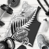 Men's black rugby tank top with white Aotearoa graphic and fern leaf print