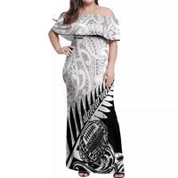 Women’s off-shoulder maxi dress with black-and-white tribal print, ruffled neckline