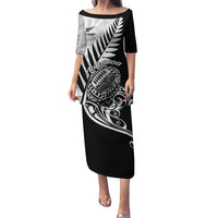 Black rugby pulletasi long dress with silver fern and Maori-style tribal print, front view