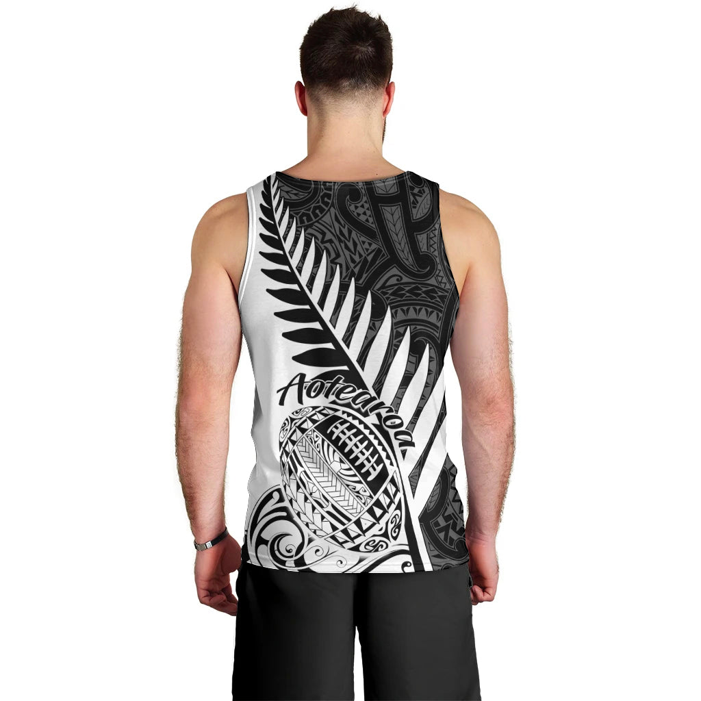 Men's white rugby tank top with black back print featuring fern and Aotearoa script, sleeveless.