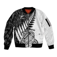 Two-tone white and black rugby sleeve zip bomber jacket with bold Maori fern graphic