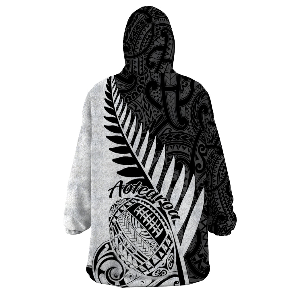 Hooded blanket sweatshirt with black-and-white Aotearoa lettering and fern graphic