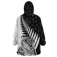 Hooded blanket sweatshirt with black-and-white Aotearoa lettering and fern graphic