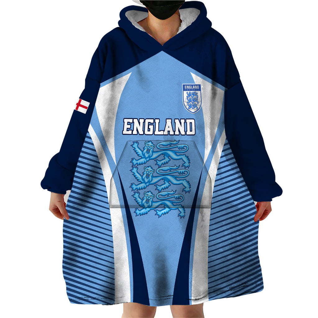 Blue wearable blanket hoodie worn with large England graphic and hooded blanket