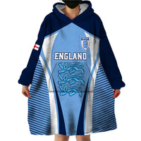 Blue wearable blanket hoodie worn with large England graphic and hooded blanket