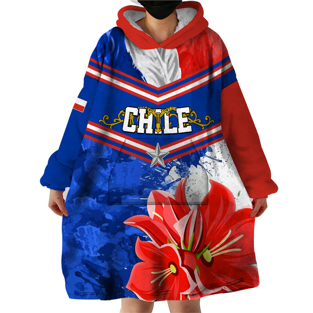 Wearable blanket hoodie in red and blue with Chile emblem and large red flower graphic.