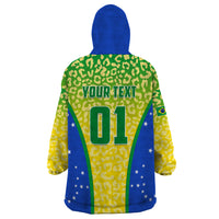 Wearable blanket hoodie back, green leopard print with 'YOUR TEXT' and number 01 on blue