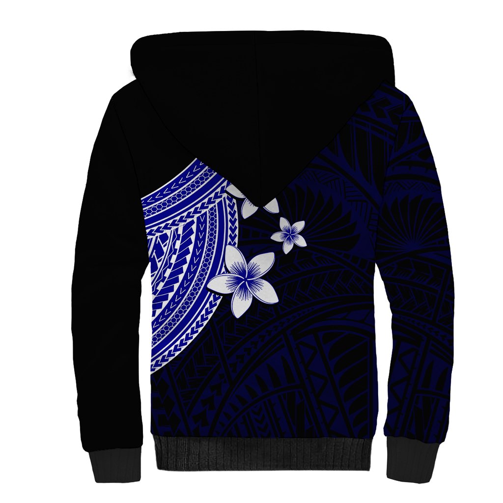 Blue sherpa hoodie back with white plumeria flowers and geometric pattern, black hood and cuffs