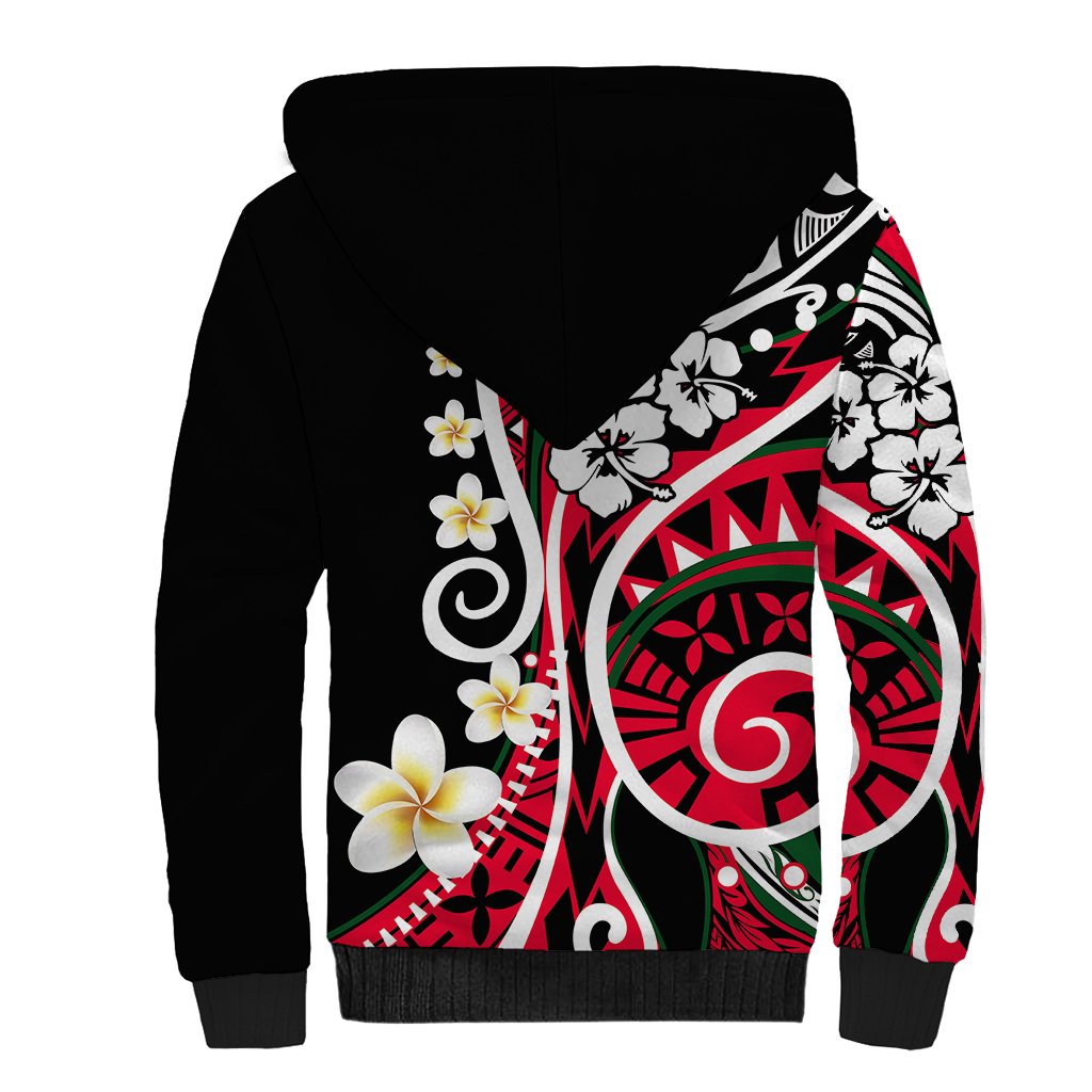 Black sherpa hoodie with white fleece-lined hood and large rear Polynesian print with flowers